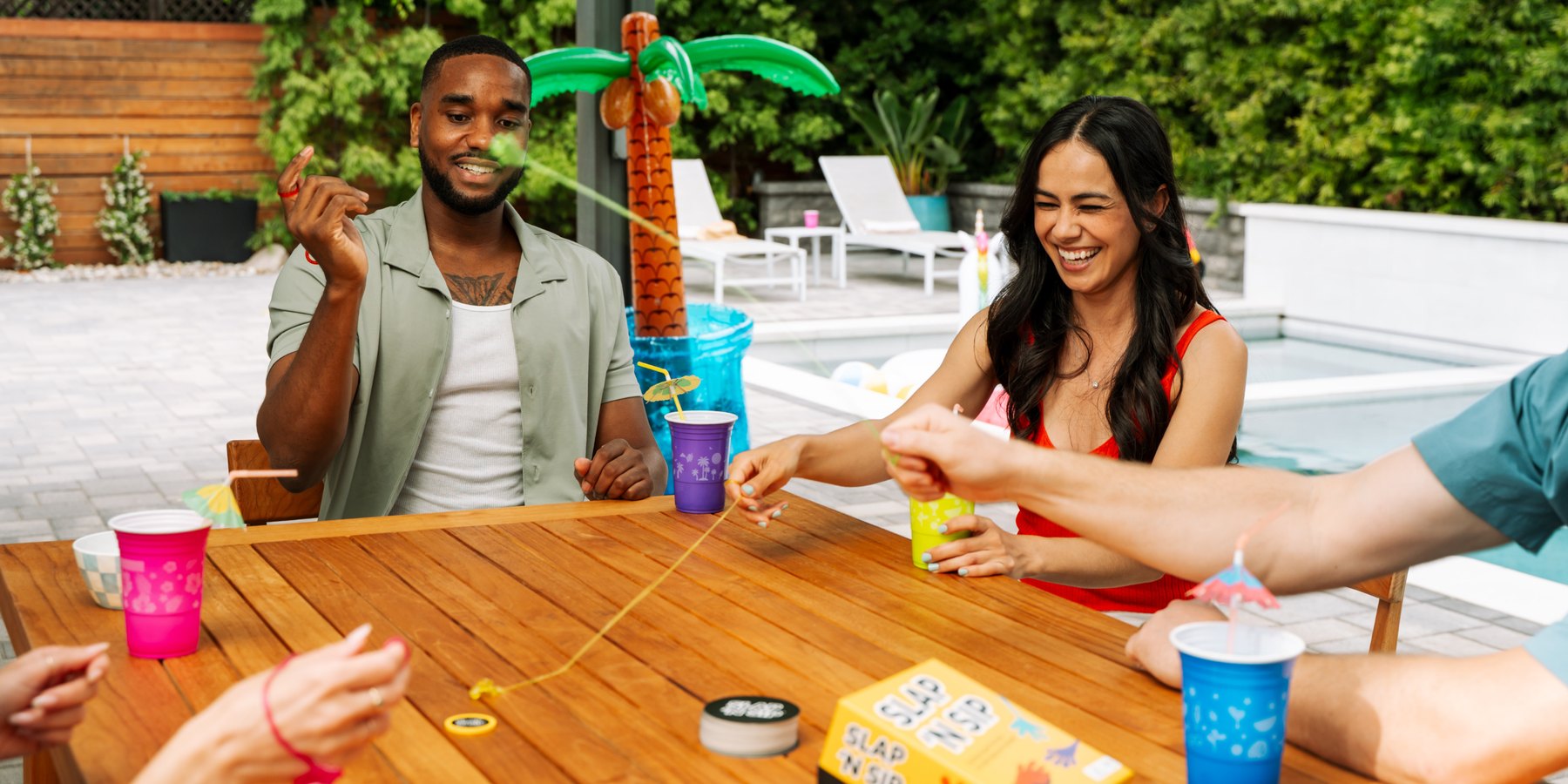 A long table of players mid-round at a Thrilly family game night